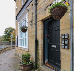 An entrance with a door and letterboxes at The Railway Apartment in Hexham