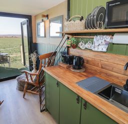 A kitchen with a sink and kettle at GiGi's Horsebox Evesham