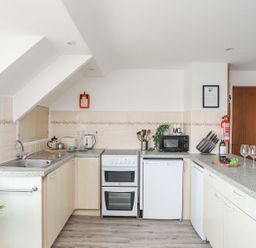 A kitchen with various appliances and utensils at Ysgo - 6 Ty'n Don in Abersoch