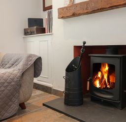 A living room with a sofa and a fireplace at Lenny's Place Watchet