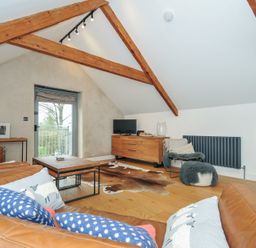 A living room with a sofa and coffee table at The Dairy in 