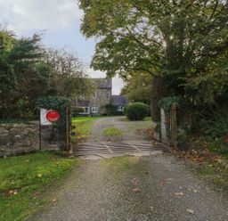 An entrance with a gate leading to a house at Ivy Court in Clarbeston Road