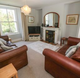A living room with sofas and a television at Pedn Brose Near Mousehole