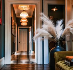 A hallway with a vase and pampas grass at St Anne's Manor in Torquay
