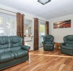 A living room with two armchairs and a sofa at Willow Lodge near Liskeard