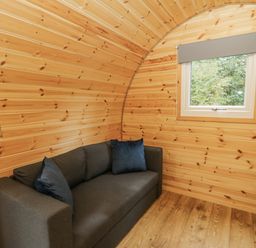 A room with a sofa and window at Oak View Rhayader