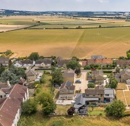 An aerial view of houses and fields at Manor Farm House in Merton near Bicester