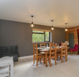 A dining room with a table and chairs at Willow Cottage Whiteparish