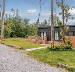 A house with a deck and pathway at Somersby (Pet) Louth