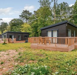 Cabins with decking and grass at Somersby (Pet) Louth
