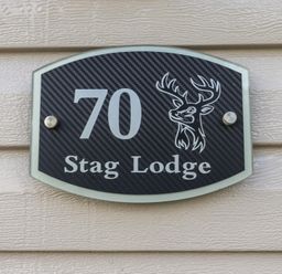 A plaque with the number 70 and Stag Lodge at Stag Lodge, Caravan 70 Great Yarmouth