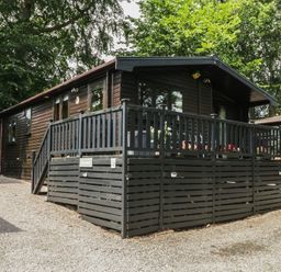 A cabin with a deck and parking area at Watendlath in Keswick