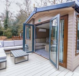 A living room with a sofa and coffee table at Wild Duck Holiday Park Belton Norfolk