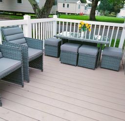 a patio with seating and a table at Hafan y Mor Haven - Holiday Accommodation 15817 in Pwllheli