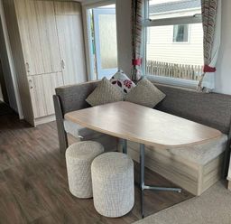 a dining area with a table and seating at Unity Holiday Resort - Holiday Accommodation 15970 Brean Sands