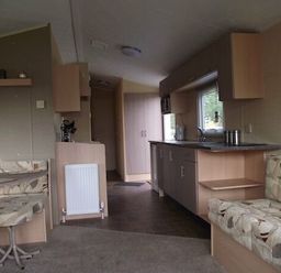 a kitchen and living area with seating and a table at Butlins Minehead - Holiday Accommodation 1700 in Minehead
