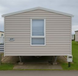 A static caravan with a window at Whitehouse Leisure Park - Holiday Accommodation 19055 Towyn, Abergele