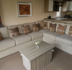 A living room with a sofa and coffee table at Whitehouse Leisure Park - Holiday Accommodation 19057, Towyn, Abergele
