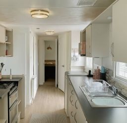 A kitchen with sink and oven at Golden Gate Holiday Centre - Holiday Accommodation 19058 Towyn