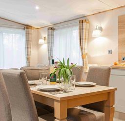 a dining area with a table and chairs at Kelling Heath Holiday Park - Holiday Accommodation 19669 in Holt