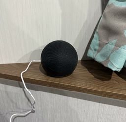a black spherical smart speaker on a wooden shelf at Butlins Skegness - Holiday Accommodation 21028, Skegness
