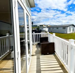 A deck area with chairs at Ocean Edge Leisure Park - Holiday Accommodation 21286 Morecambe