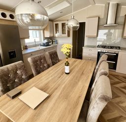 A kitchen with a table and chairs at Ocean Edge Leisure Park - Holiday Accommodation 21286, Morecambe