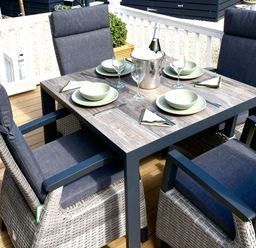 An outdoor dining area with a table and chairs at Aberdunant Hall Holiday Park - Holiday Accommodation 21962 in Prenteg