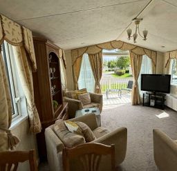 a living room with a TV and comfortable seating at Butlins Skegness - Holiday Accommodation 22071 in Ingoldmells
