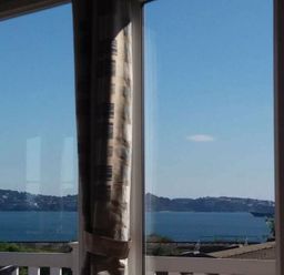 a view of water and land through a window with curtains at Waterside, Paignton - Holiday Accommodation 2287, Paignton