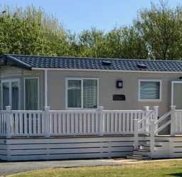 a holiday home with a porch and steps at Greenacres Holiday Park - Holiday Accommodation 6757 in Porthmadog