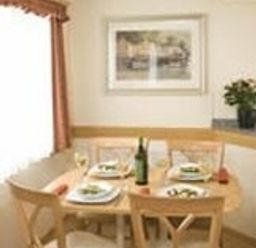 a dining area with a table set for four at Perran Sands - Holiday Accommodation 8131 in Perranporth