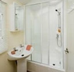a bathroom with a shower stall and a sink at Perran Sands - Holiday Accommodation 8131 in Perranporth