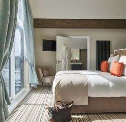 A bedroom with a bed and a window at Ferry Hills in Laugharne