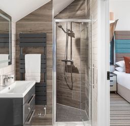 A bathroom with shower and basin at Ferry Hills in Laugharne