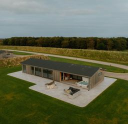 A house with a hot tub and outdoor furniture at The Sheraton Retreat in Wigton