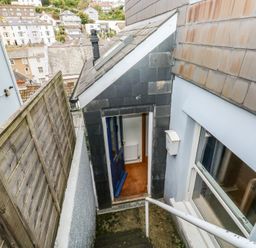 An outdoor staircase leading to a door at 58A South Ford Road Dartmouth