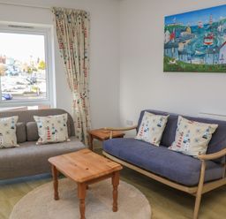 A living room with sofas and a coffee table at Brewery View in Weymouth