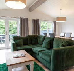 A living room with a green sofa and coffee table at Wensleydale in Aysgarth