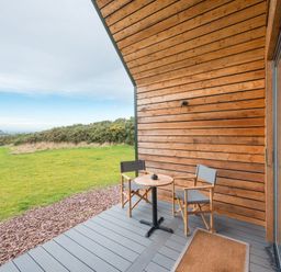 An outdoor patio with a table and chairs at The Weir in North Berwick
