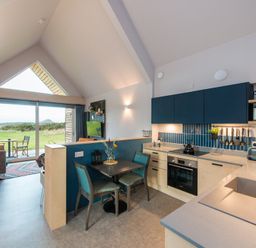 A kitchen with dining area and living space at The Weir in North Berwick