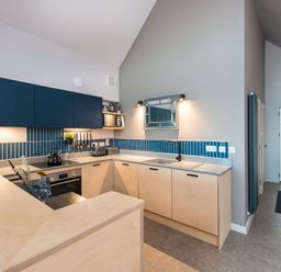 A kitchen with cabinets and a sink at The Weir in North Berwick