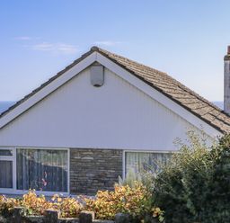 A house with a chimney and window at Woodbury Teignmouth