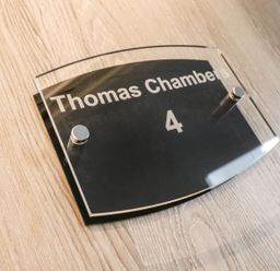 A sign displaying Thomas Chambers and room number 4 at Thomas Chambers in Camborne