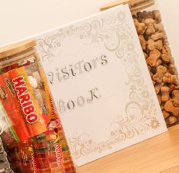 A visitor book and jars of candy and snacks at Thomas Chambers in Camborne