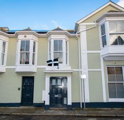 A building facade with doors and windows at Daniel Chambers in Camborne