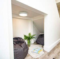 A snug area with bean bags and a plant at Daniel Chambers in Camborne