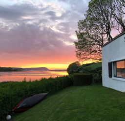A house with a kayak by the river at Bryncyn in Newport, Pembrokeshire