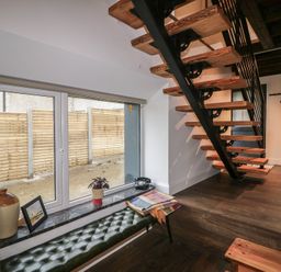 An indoor area with a staircase and window at The Loft in Glenmore, County Kilkenny