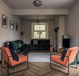A living room with furniture and a window at Green Bank in Betws-Y-Coed